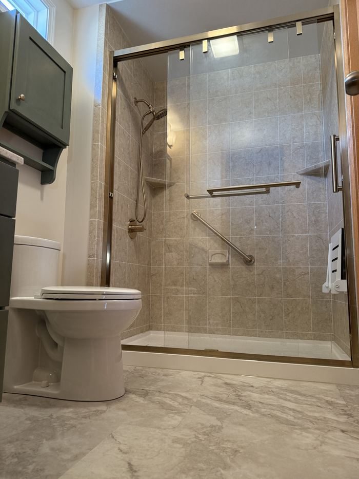Tub-to-shower by Bathrooms First